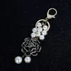 新しいトレンディなファッションIns豪華なデザイナーかわいいCamellia Flower Mutli Pearls Tassel Bag Charms keychains for women girls343z