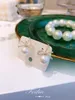 S1951 Modna biżuteria Rhinstone Bowknot Faux Pearl Eleganckie kolczyki
