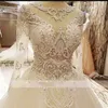 Abito da ballo di lusso Abiti da sposa con gioiello collo trasparente Appliques di pizzo Paillettes Perline robe de mari￩e Abito da sposa a maniche lunghe con retro trasparente