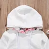 Pasgeboren baby herfst winter kleding baby jongen meisje lange mouw hooded tops + floral broek hoofdband outfit baby kleding set LJ201221