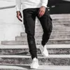 Męskie jesienne zimowe kieszonkowe patchworkowe spodnie do biegania długie spodnie bojówki Streetwear H1223