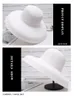 新しい女性の夏の女性帽子ヘップバーンスタイルビンテージデザインワイドサイドストローハットソリッドカラービーチホリデービーチキャップビッグサンキャップY200714