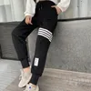 Pantaloni da uomo e da donna classici pantaloni della tuta a righe a quattro barre casual