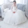 2021 Abiti da ragazza di fiori a maniche lunghe in pizzo Scoop Ball Gown Princess Little Girls Wedding Party Dress Abiti da prima comunione