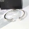 Donia Jewelry Luxus-Armreif, übertrieben, doppelendiges Kugel-Titanstahl-Micro-Set-Zirkon-Geschenkarmband für europäische und amerikanische Modedesigner