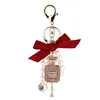 Creative Handmade Diy Diamante Perfume Frasco Acessórios Liga Bow Pearl Luxo Keychain Bolsas Charme Pingente YS068