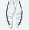 Spodnie dresowe Chłopcy Dziewczyny Spodnie Sportowe Mężczyźni Kobiety Joggers Casual Spodnie Wiosna Letnie Pant Spodnie Dressuit Dna 2022 Moda Styl