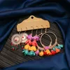 Isang boho стиль кисточка свитки свита серьги женское перо цветок сладкий конфеты цвета капля серьги ювелирные изделия 3pair / set