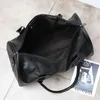 Bolsa de bagagem de couro PU da moda Bolsas de armazenamento de roupas grandes de viagem zíper de fim de semana comercial ombro unissex1