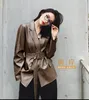 Outono novo design feminino gola virada para baixo moda blazer terno estilo PU couro faixa média longa casaco SMLXL