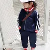Kids Tracksuits Two Pieces Set Boys Girls Letter Printed Teen Top Jackets + Pants Casual Sport Style Clothing Suit Child Clothes Fashion 2 Styles 90-130