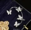 輝くジルコンの耳カフクリップイヤリングの結婚式のジュエリーGC797のための穿刺なしの銀メッキの金属の蝶の耳のクリップ