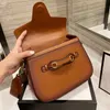 1955 أكياس السرج حقيبة كتف أزياء النساء CrossBody حقيبة يد جودة luxurys كبار المصممين مخلب سيدة محفظة حقائب يد معدنية جلد طبيعي أبازيم طباعة