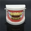 Hip Hop Electroplate Glod Teath Grillz Cross Texture الأسنان تقليد وأعلى ولأسفل الحلي الحلي سهلة الاستخدام 10GMH1