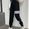 Pantaloni da uomo e da donna classici pantaloni della tuta a righe a quattro barre casual