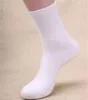 Groothandel heren midden buis sokken mode trend effen kleur sport stretch zakelijke aandelenontwerper winter mannelijke casual midden lengte warme sok