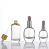 Plano redondo redondo clara vidro essencial perfume frascos de perfume líquido reagente Garrafa de conta-gotas 15ml 30ml 50ml prata / ouro tampão