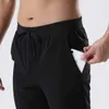 L-003 Pantalons de survêtement pour hommes Joggers de loisirs avec poches Ceinture à cordon de serrage Athletic Yoga Lounge Track Pant Workout Running Pantalons tenues de fitness