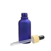 Opakowania Butelka Refillable Butelka Fałszywa Drewna Pokrywa Guma Kroplówki Pusta Frost Blue Glass Essence Essencja Fiolki Olejowe 5ml 10ml 15 ml 30 ml 50 ml 100 ml