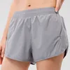 Yoga andningsbara korta byxor outfit 10 färger dolda blixtlås med fickficka kvinnors sport shorts lösa andas andas av sportkläder träning fitness slitage s1204