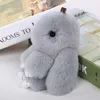 Fluffy Bunny Keychain Kvinnor Söt Kanin Fur Boll Key Holder Pompon Toy Doll Väska Charm Bil Pompom de Forure KeyRings Smycken G1019