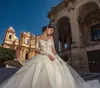 Modernes Hochzeitskleid mit schierem Ausschnitt und Spitzenapplikationen, Pailletten, herzförmiger Kapellenschleppe, langen Ärmeln, maßgeschneidertes Braut-Vestido de Novia
