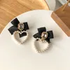 svart pearl diamond earrings