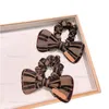 Nuovo modello di alta qualità Donne Designer Letter Band Band Band Bowknot Letters Elastic Horsrope Pony Cotail Porta dei capelli di lusso Acces2654815