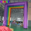 Niestandardowy kolorowy plac nadmuchiwany łuk tęczy z dmuchawa reklama tunel wejściowy do dekoracji przyjęcia urodzinowego