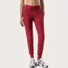 Tessuto Naked-feel Workout Sport Joggers Pantaloni cropped Pantaloni da donna con coulisse in vita Pantaloni sportivi da corsa con due tasche laterali