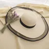 Letnie szerokie grzbietowe czapki słomkowe duże czapki słoneczne dla kobiet ochrona UV Panama Foppy Beach Hats Ladies Bow Hat Ochrona przed słońcem Wakacje T8824118