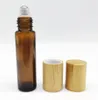 2021 Botella enrollable de vidrio de 10 ml de fábrica con tapa de bambú para aceites esenciales, botellas de muestra de perfume transparentes recargables ecológicas