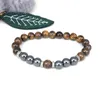 Pärlsträngar Tiger's Eye Black Magnet Pärlor Elastiska sladdarmband Män armband Natural Stone Chain Chakrayoga Fashion Accessories smycken i