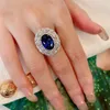 Choucong Marca Anillos de boda Ins Top Venta Joyería de lujo Plata de ley 925 Corte ovalado Azul Zafiro CZ Diamante Piedras preciosas Mujeres Opem Anillo de compromiso ajustable