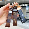 Luxury Men'S Waist Buckle Leather Presbyopia Keychain Pendant designer Car Key Chain Ring Fashion Couple Creative Gift H1011