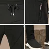 Czarne spodnie sportowe Mężczyźni Letnie Oddychające Szybkie Suche Casual Zipper Kieszonkowy Spodnie dresowe Mężczyźni Marka Moda Luźne męskie Spodnie 211201