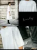 Sommar kortärmad koreansk mäns långa t-shirt över knäet vita stora pengar i halvmärmad lös 210629