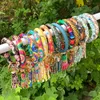 90 styles de mode multiple motif fleur de soleil/drapeau porte-clés en cuir Wrap glands bracelets porte-clés bracelet bracelet gland porte-clés rond bracelet porte-clés