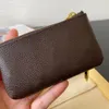 Top Mens Womens KEY Wallet POUCH POCHETTE CLES Дизайнерские сумки Кожаное кольцо Держатель кредитной карты Портмоне Мини-кошелек M62650