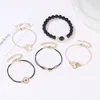 Bedelarmbanden modeketen voor dames en meisjes hartvormige figuur 8 patroon snaar mat zwart kralen armband set van 4 stuks