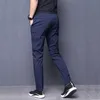Calça de verão masculino magro esticado coreano casual calça fit fit chino chino cintura vestido corredor calças masculino preto azul x0615