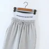 Kobiety Moda Proste Wszechstronne luźne spodnie Solidna koronka w górę Stretch Talia Dorywczo Szerokie spodnie FEMME 210531