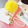 Keychains Faux Fur Ball PomPom Fluffy Pearl Chain Bow Badge Keychain Women Bag Charm Trinket Gold Color Keyring Car Accessory1 Smal22