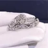 Choucong Ins トップセール結婚指輪スパークリング高級ジュエリー 10KT ホワイトゴールドフィル ラウンドカット トパーズ CZ ダイヤモンド宝石エタニティ女性クロスバンドリング恋人へのギフト