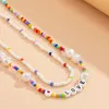 Colliers SHIXIN Bohême Couches de perles colorées Collier ras du cou pour femmes Mode Lettre Colliers 2021 Bijoux courts sur le cou