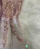 Haute qualité célébrité bandage sexy col en V manches paillettes luxe plumes fête rose blanc mini robe 210309