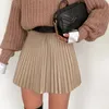 솔리드 드립 된 가짜 여성의 짧은 스커트 A 라인 하이 스트리트 섹시한 미니 스커트 2021 패션 한국 높은 허리 주름진 가죽 옷감 210309