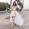 Boho kant zeemeermin jumpsuits trouwjurken afneembare trein een schouder lange mouwen backless strand bruidsjurken met broek