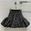 Kjolar puffy svart 2021 tidig vår söt hög midja elastisk veckad mini high-end polyester bollklänning kjol