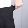 Printemps Automne Femmes Jupe Plissée Coréenne Mince Sexy Couleur Unie Oblique Poche Élastique Taille Haute Jupe Noir Mini Jupe 210306